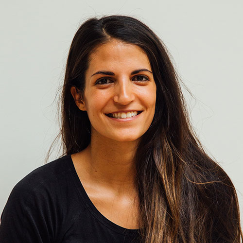 Woman smiling A woman with long hair smiles for the camera.