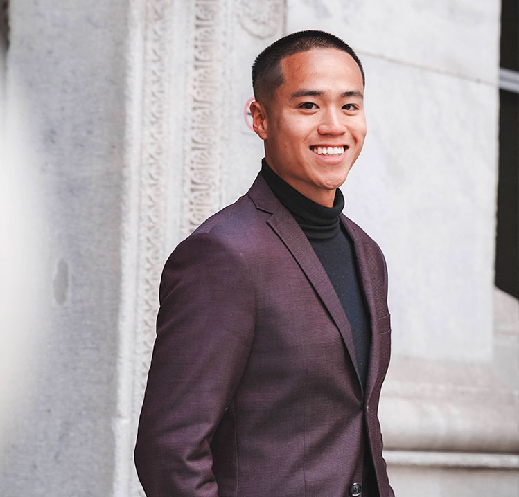 Man smiling A man in a suit smiling for the camera.
